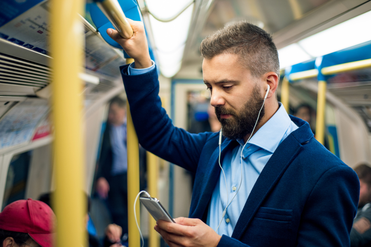 Man commuting to work on public transit