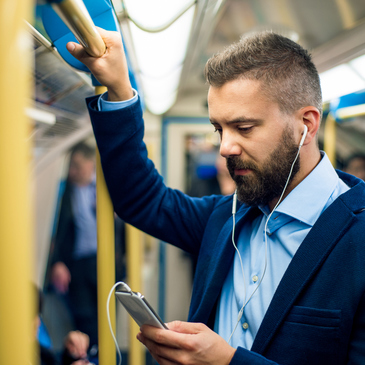 Man commuting to work on public transit